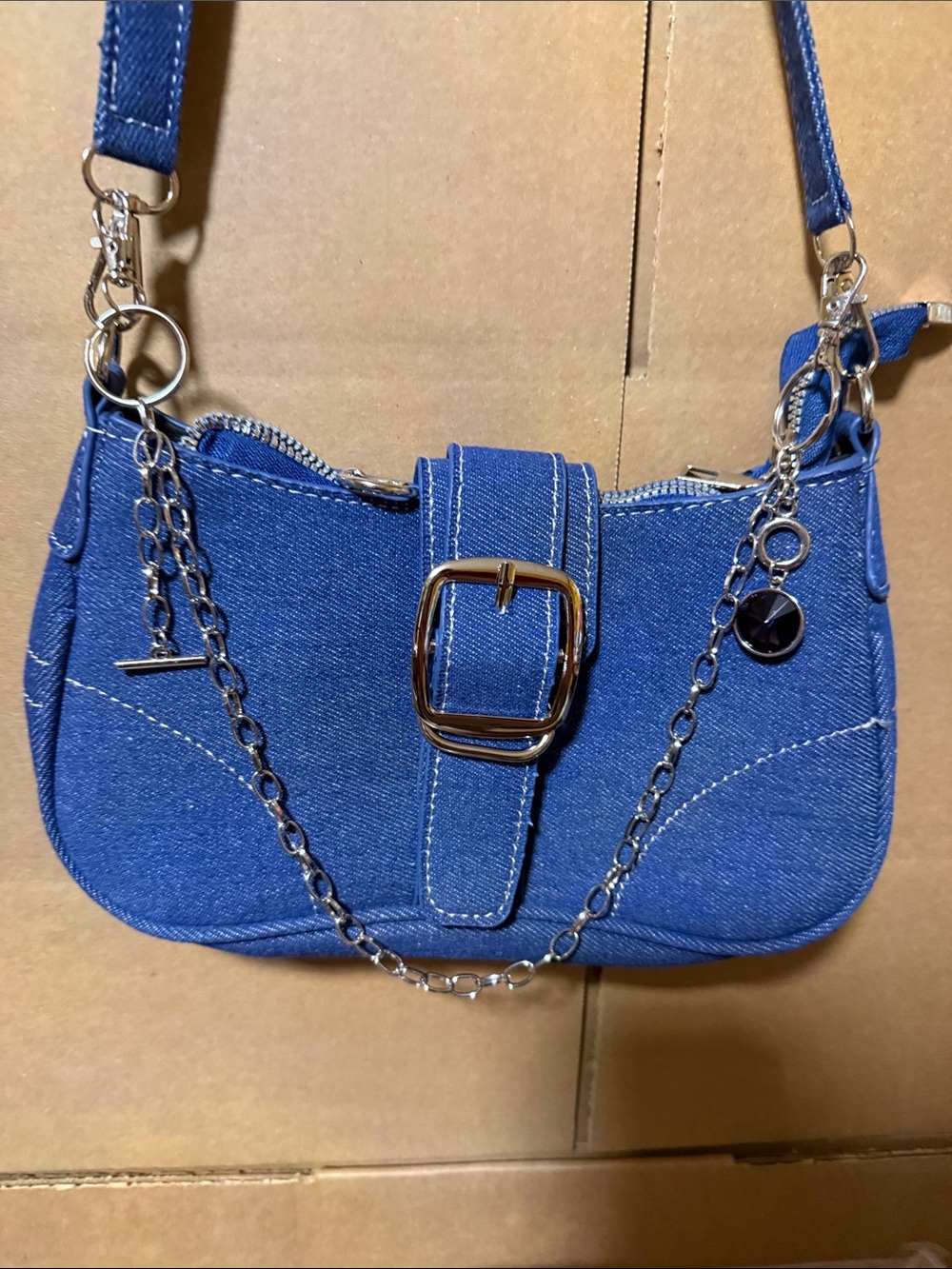 Blue Denim Shoulder Bag with Silver Chain Accent. Bag not for sale